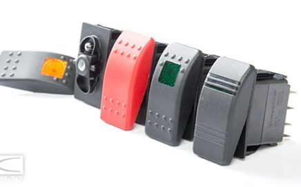 Carling Switch actuators lined up with a white background